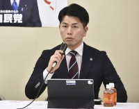 Takuya Matsunaga, who suffered from negative social media posts after losing his wife and daughter in a high-profile car accident in 2019, speaks of his experience at a meeting held at the Liberal Democratic Party headquarters in Tokyo in November. | Kyodo
