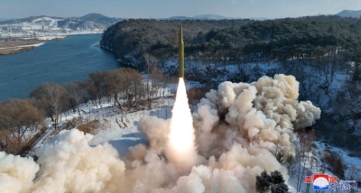An intermediate-range ballistic missile, said to be solid-fueled, is launched during a test at an unspecified location in North Korea in this picture released Monday. 