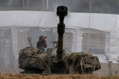 An Israeli artillery unit fires amid the ongoing conflict between Israel and the militant group Hamas, near the Israel-Gaza border, in southern Israel, on Sunday.
