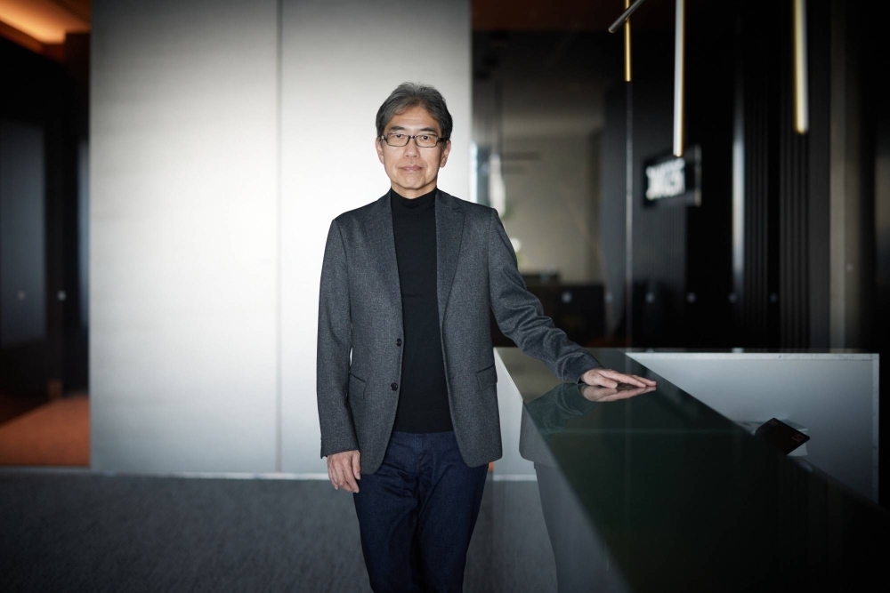 Resonac CEO Hidehito Takahashi says the company may buy a stake in chip materials maker JSR.