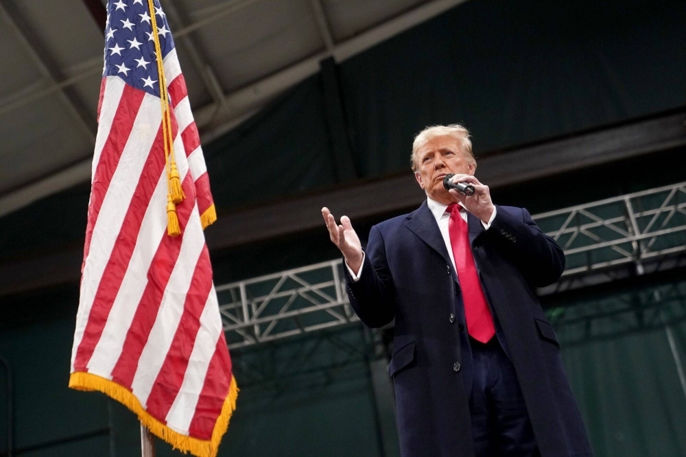 Former U.S. President Donald Trump speaks during the 2024 Iowa Republican caucuses at Horizon Events Center in West Des Moines, Iowa, on Monday.