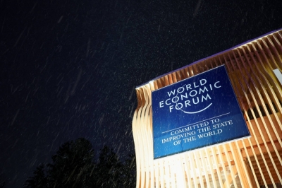 A banner for the World Economic Forum hangs on a building on the first day of the annual meeting in Davos, Switzerland, on Monday. 