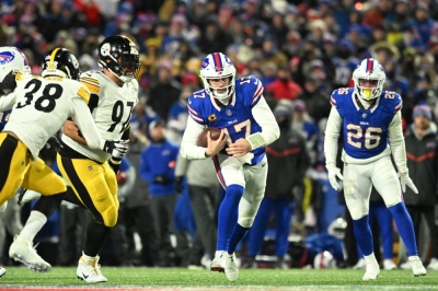 Buffalo Bills quarterback Josh Allen runs the ball in the second half against the Pittsburgh Steelers in a 2024 AFC wild-card game in Orchard Park, New York, on Monday.