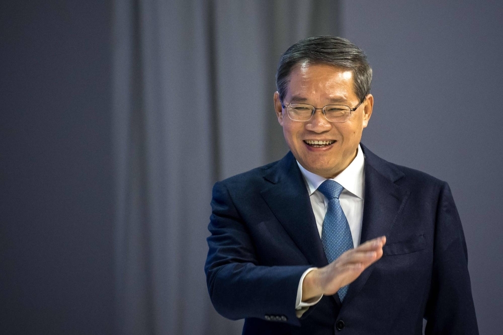 Chinese Premier Li Qiang arrives on stage during the annual meeting of the World Economic Forum in Davos, Switzerland, on Tuesday. 2024.