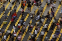 People cross a street in the Mong Kok district in Hong Kong in 2011. | REUTERS