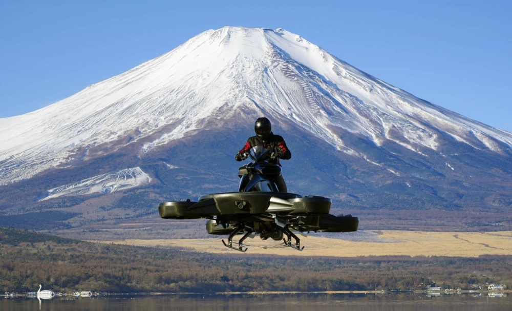 An Xturismo bike flies over Lake Yamanaka in Yamanashi Prefecture.