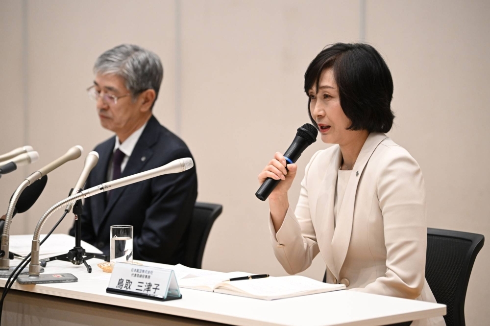 Mitsuko Tottori (right), incoming president of Japan Airlines, speaks alongside Yuji Akasaka, the outgoing president, during a news conference in Tokyo on Wednesday.