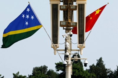Flags of Solomon Islands and China flutter near the Tiananmen Gate in Beijing on July 11, 2023.