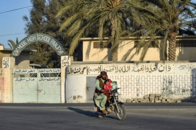 A motorcyclist rides past a high school in the Panjgur district of Balochistan province on Wednesday. Pakistan has recalled its ambassador from Iran and blocked Tehran's envoy from returning to Islamabad after an Iranian air strike killed two children in the west of the country on Wednesday. Pakistan's official statement did not specify where the strike took place, but Pakistani media said it was near Panjgur, where the countries share a sparsely populated border of nearly 1,000 kilometers.