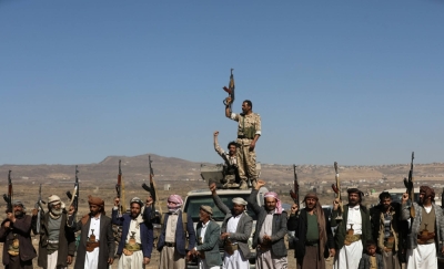 Houthi fighters and tribal supporters hold up firearms during a protest against recent U.S.-led strikes on Houthi targets, near Sanaa, Yemen, on Sunday.