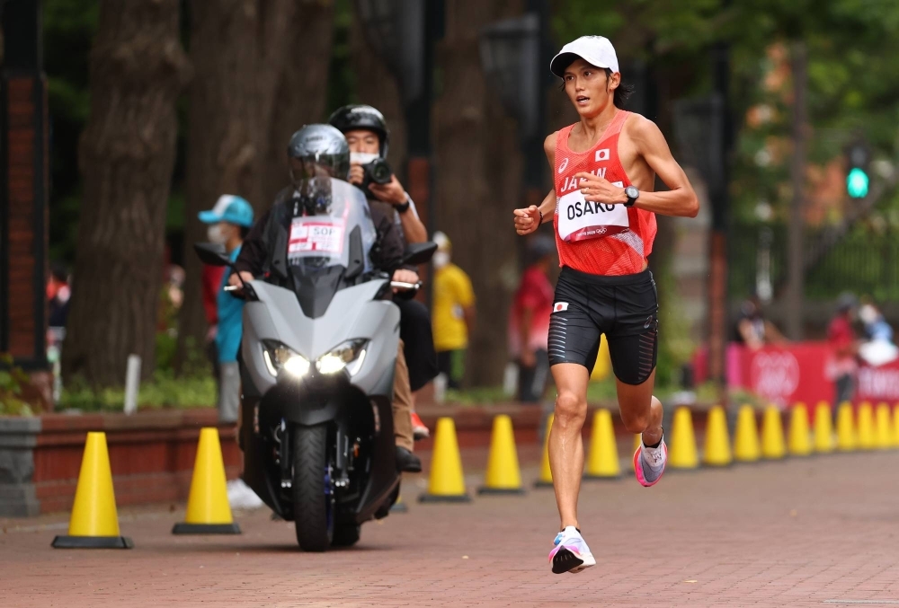 Suguru Osako runs during the men's marathon at the Tokyo Olympics in Sapporo on Aug. 8, 2021.
