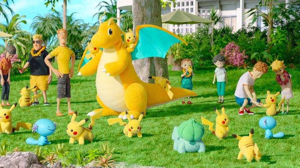 A group of Pikachu, three riding a Dragonite, play with Woopers, a Bulbasaur and other resort guests in “Pokemon Concierge.”