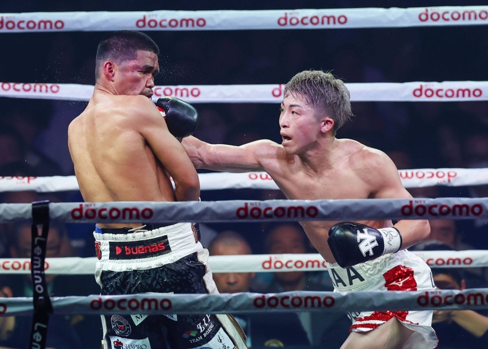 Naoya Inoue (right) throws a punch during his bout against Marlon Tapales in Tokyo last month. 