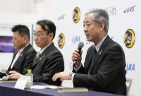 JAXA President Hiroshi Yamanaka (right) speaks during a news conference alongside other JAXA officials on Saturday after the agency's lander touched down on the moon.  | Kyodo 