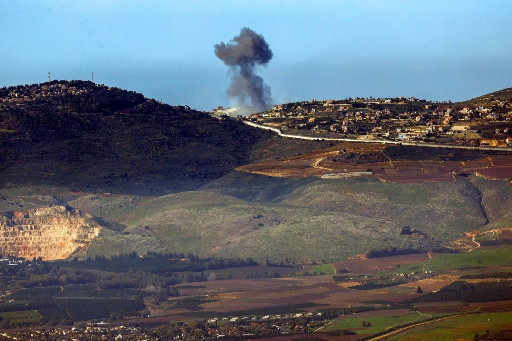 Smoke billows over the Lebanese village of Odaisseh on Saturday during Israeli bombardment amid cross-border tensions in the Middle East. 