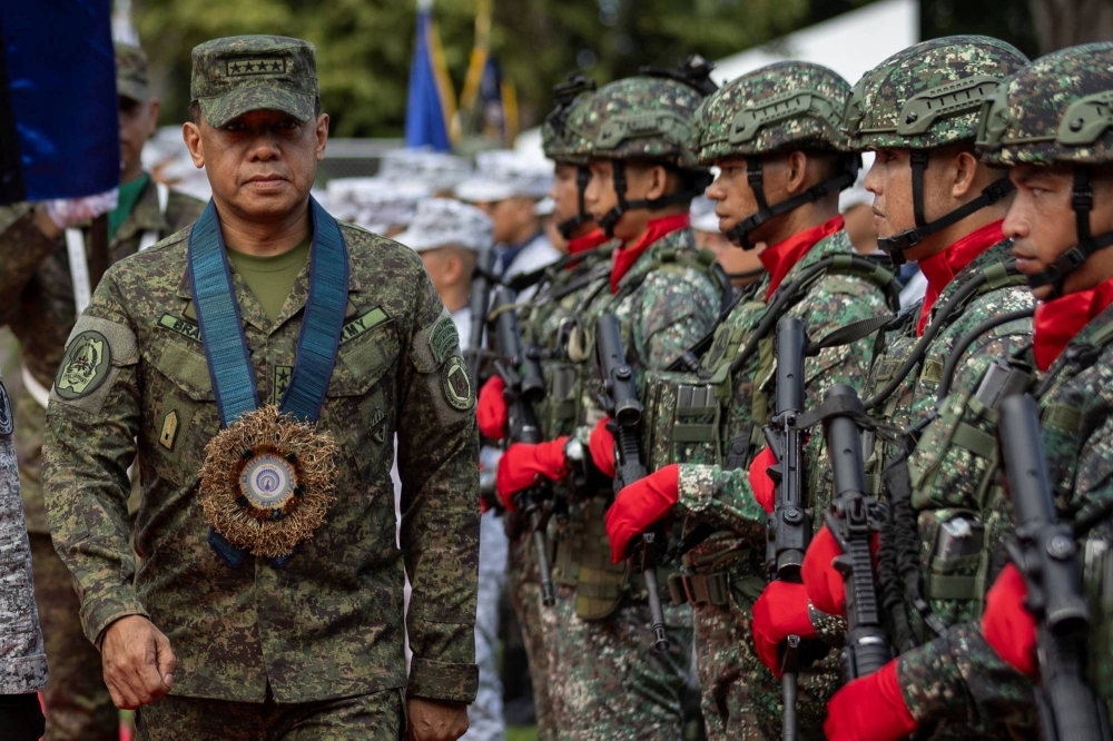 Philippine Armed Forces Chief of Staff Gen. Romeo Brawner walks past an honor guard during the arrival ceremony at Western Command, in Puerto Princesa, on the Philippine island of Palawan last August.