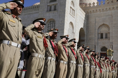 Military cadets salute during a military funeral procession for Houthi fighters killed in recent U.S.-led strikes on Houthi targets, in Sanaa, Yemen, on Wednesday.