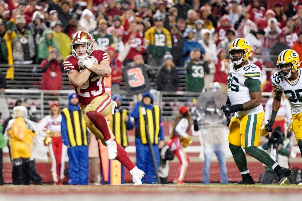 San Francisco running back Christian McCaffrey races into the end zone during the fourth quarter of the 49ers NFC divisional game win over the Packers on Saturday in Santa Clara, California. 