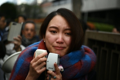 Journalist Shiori Ito sheds a tear as she speaks to reporters outside the Tokyo district court on Dec. 18, 2019, after hearing the ruling on a damages lawsuit by her, accusing a former TV reporter of rape. 