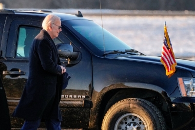 U.S. President Joe Biden walks to board Marine One at Delaware Air National Guard Base, in New Castle, Delaware, on Sunday.