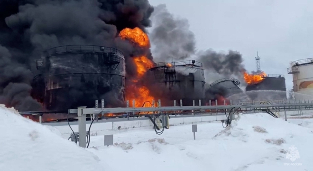 Local authorities say oil tanks at this storage facility caught fire after the military brought down a Ukrainian drone, in the town of Klintsy in the Bryansk Region, Russia, on Friday.