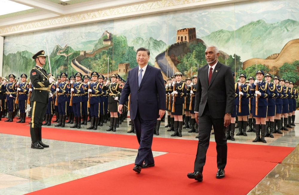 Chinese President Xi Jinping and Maldivian President Mohamed Muizzu attend a welcome ceremony at the Great Hall of the People in Beijing on Jan. 10.