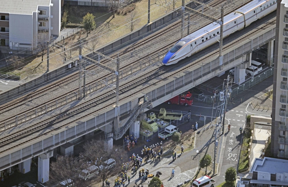 A shinkansen is stopped due to a power outage on a section in the city of Saitama shortly before noon on Tuesday.