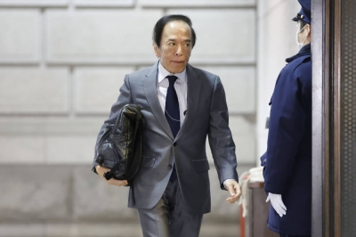 BOJ Gov. Kazuo Ueda enters the Bank of Japan headquarters in Tokyo on Tuesday.