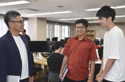Subash Rijal (center) meets with colleagues in Matsuyama, Ehime Prefecture, in September.
