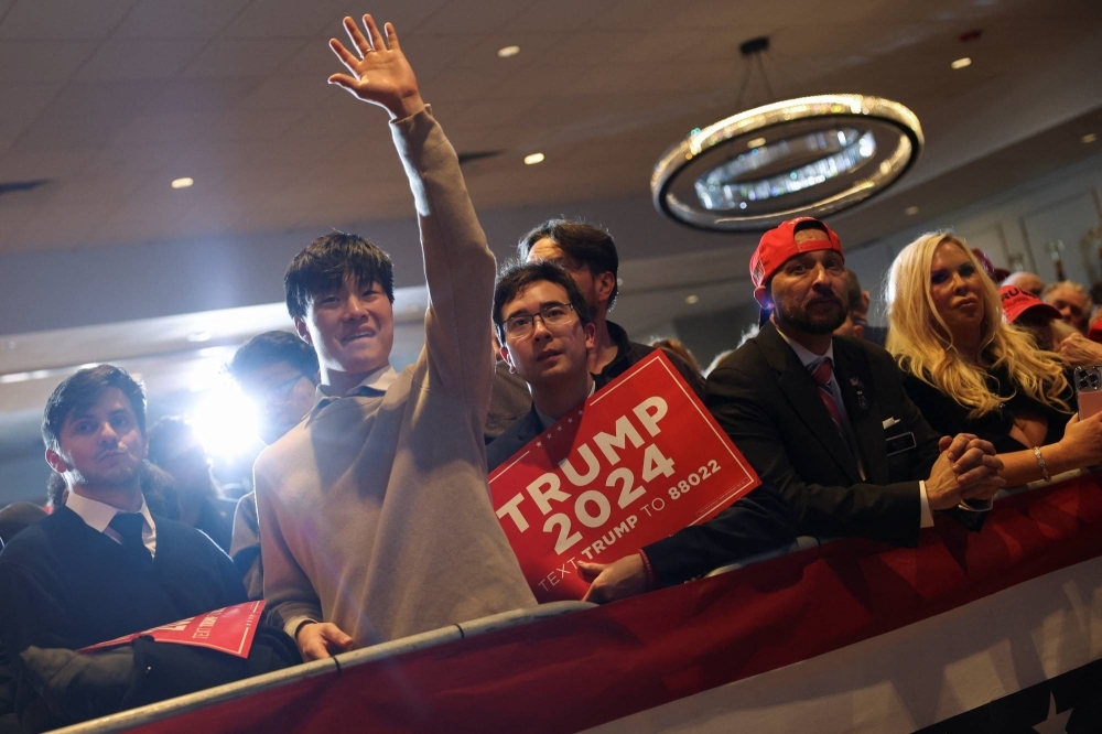 Supporters of former U.S. President Donald Trump react as results are announced during his New Hampshire presidential primary election night watch party in Nashua, New Hampshire, on Tuesday.