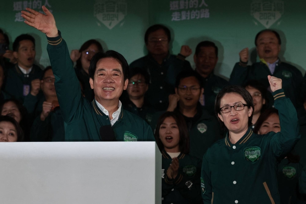 Taiwan's President-elect Lai Ching-te (left) and his running mate Hsiao Bi-khim after Lai's presidential win in Taipei on Jan. 13.