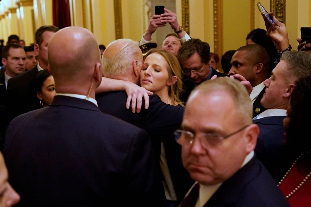 American President Joe Biden hugs Brittany Alkonis after giving a State of the Union in February. The wife of jailed U.S. sailor Lt. Ridge Alkonis ran a successful pressure campaign to get her husband released from a Japanese prison into American custody. 