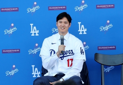 Shohei Ohtani speaks during his introductory news conference with the Dodgers at Dodger Stadium on Dec. 14, 2023.