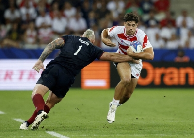 Japan's Dylan Riley (right) attempts to evade England's Joe Marler during their match at the 2023 Rugby World Cup in Nice, France, on Sept. 17, 2023.