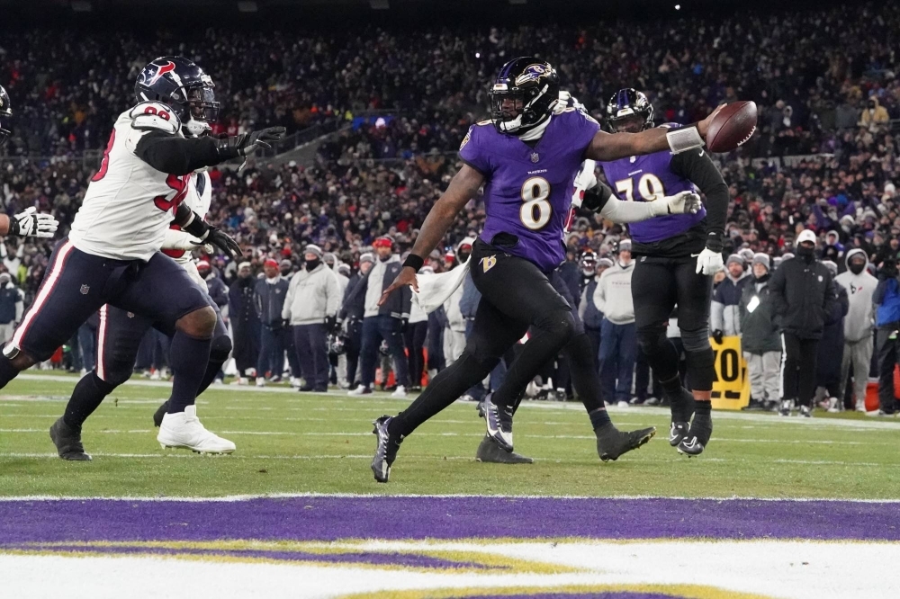 Ravens quarterback Lamar Jackson scores against the Texans during the fourth quarter of their playoff game in Baltimore, Maryland, on Jan. 20.