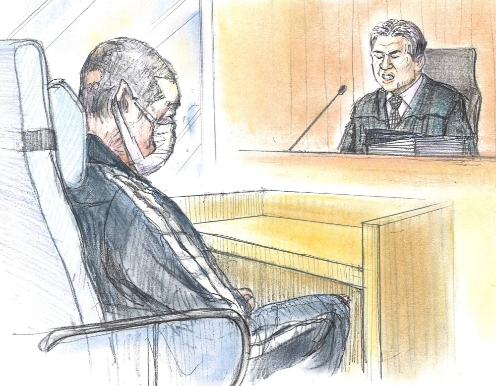 A courtroom sketch shows Shinji Aoba listening to a ruling handed down at the Kyoto District Court on Thursday.