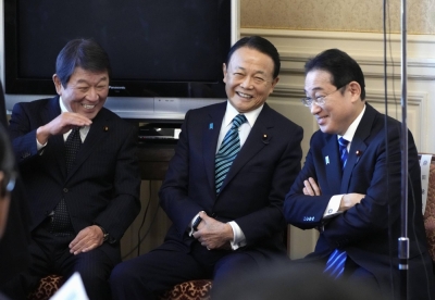 Prime Minister Fumio Kishida, Liberal Democratic Party Vice President Taro Aso and LDP Secretary-General Toshimitsu Motegi attend a party meeting in Tokyo on Friday.