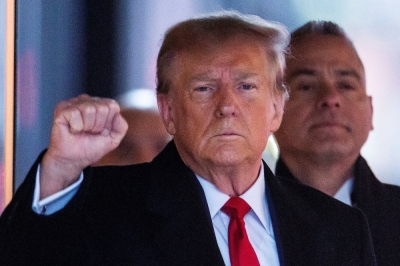 Former U.S. President Donald Trump gestures to his supporters, as he departs for his second civil trial after E. Jean Carroll accused Trump of raping her decades ago, outside Trump Tower in the Manhattan borough of New York City on Friday. 