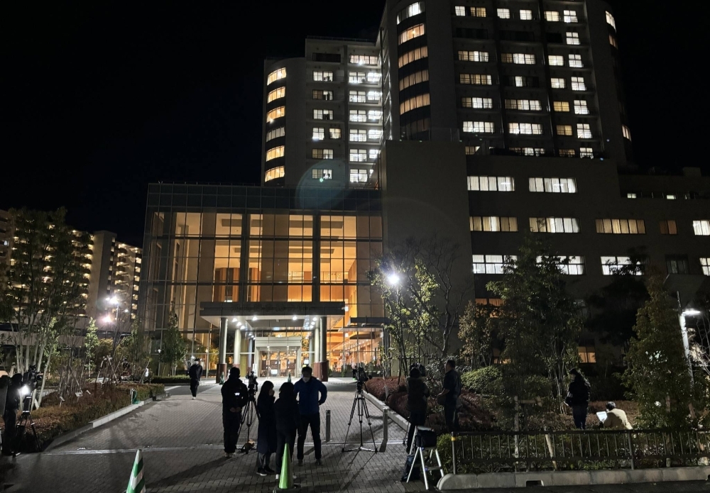 Media gather in front of the hospital in Kanagawa Prefecture where Satoshi Kirishima, a fugitive who has been on police wanted lists for almost 50 years, is believed to have been admitted.
