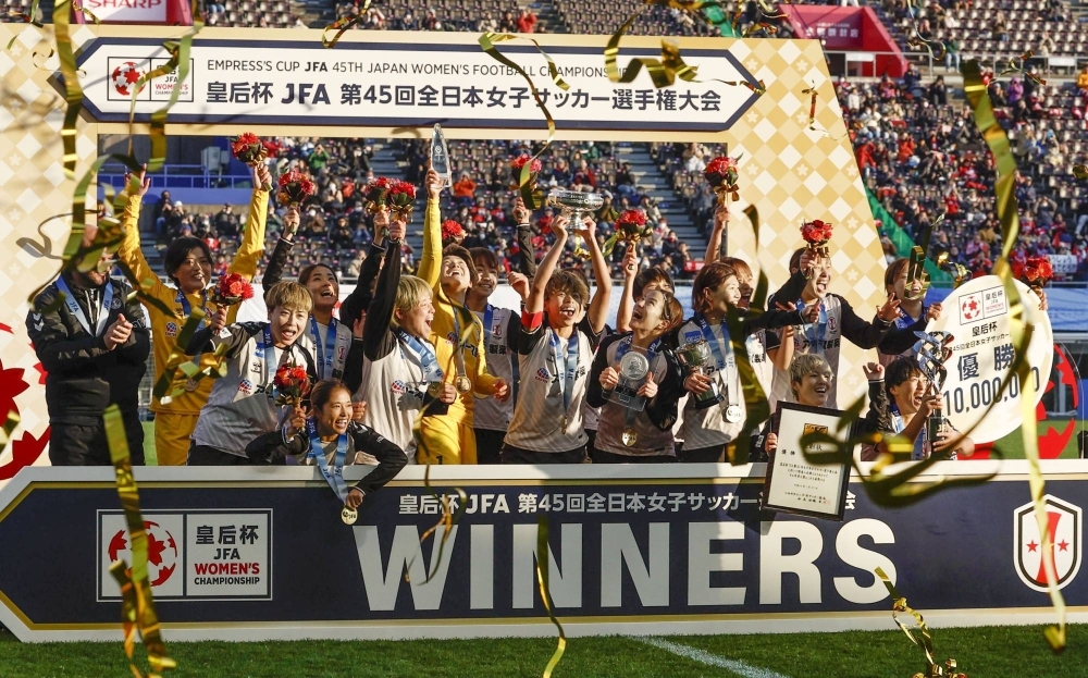 INAC Kobe Leonessa players celebrate after winning the Empress' Cup on Saturday in Osaka.
