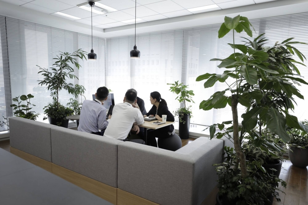 Mitsui & Co. employees hold a meeting at its headquarters in Tokyo. The company introduced a stock-based compensation system in 2020.