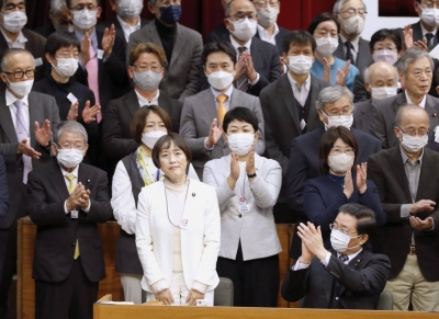 The newly appointed leader of the Japanese Communist Party, Tomoko Tamura (front left), addresses the party convention on Jan. 18. The JCP is hoping its recent leadership change will improve its electoral fortunes. 