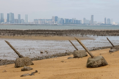 Anti-landing barricades on a beach in Kinmen, Taiwan, with China's Xiamen in the background on Dec. 18, 2023