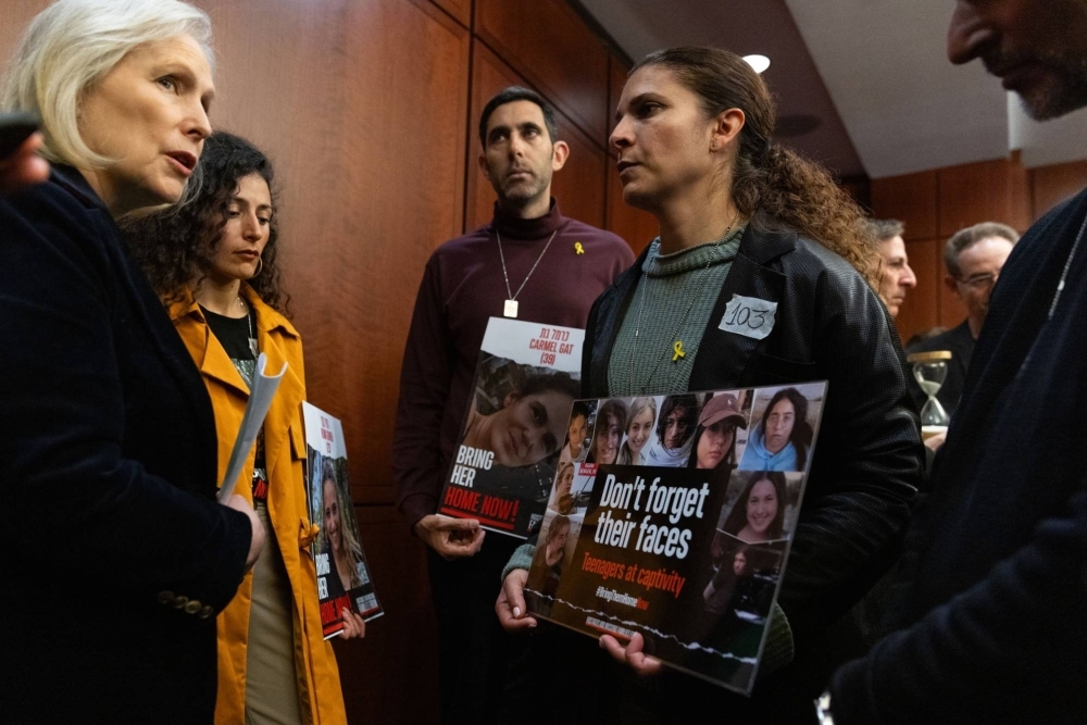 New York Senator Kirsten Gillibrand (left) speak with relatives of hostages taken by Hamas during the militant group’s Oct. 7 attack on Israel, in Washington on Jan. 17. Gillibrand was one of Saudi Crown Prince Mohammed Bin Salman's guests at discussions that took place in earlier this month.