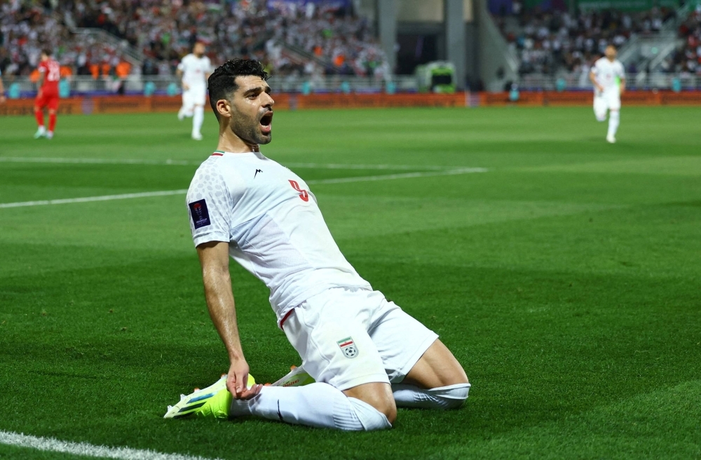 Iran's Mehdi Taremi celebrates after scoring against Syria during their Asian Cup match in Doha on Wednesday.