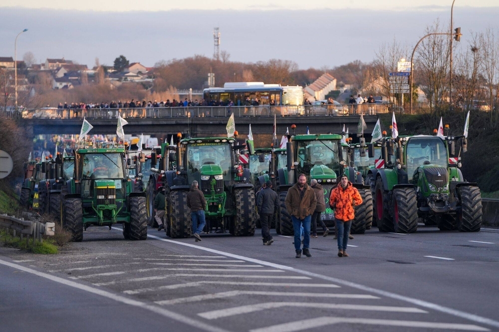Tractors block the A6 highway during a protest by French farmers in the Chilly-Mazarin district of Paris on Wednesday. 