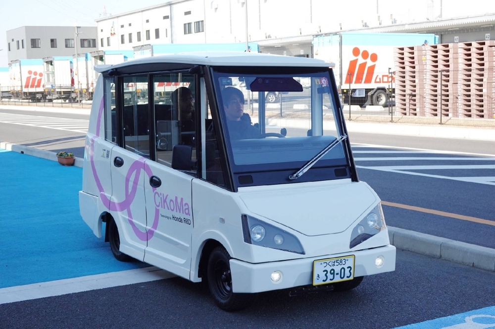 Honda's four-seater CiKoMa EV can travel at speeds of up to 20 kph.