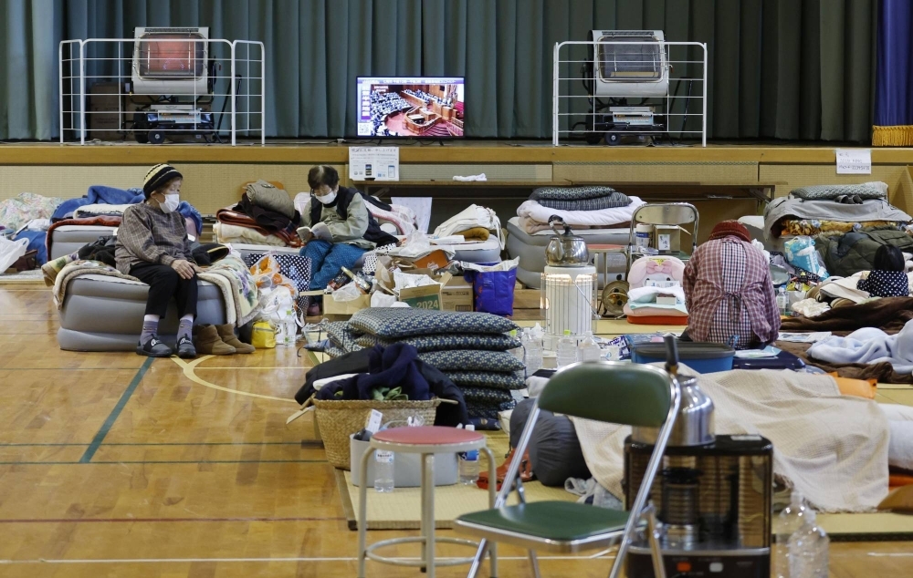 Evacuees at a school gymnasium used as an evacuation center in Anamizu, Ishikawa Prefecture, on Thursday