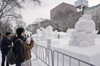 The annual snow festival opened in Sapporo on Sunday. The event, set to run through Feb. 11, features a total of 196 snow and ice sculptures at three venues, with food and drink areas set up for the first time since the outbreak of COVID-19. | Kyodo