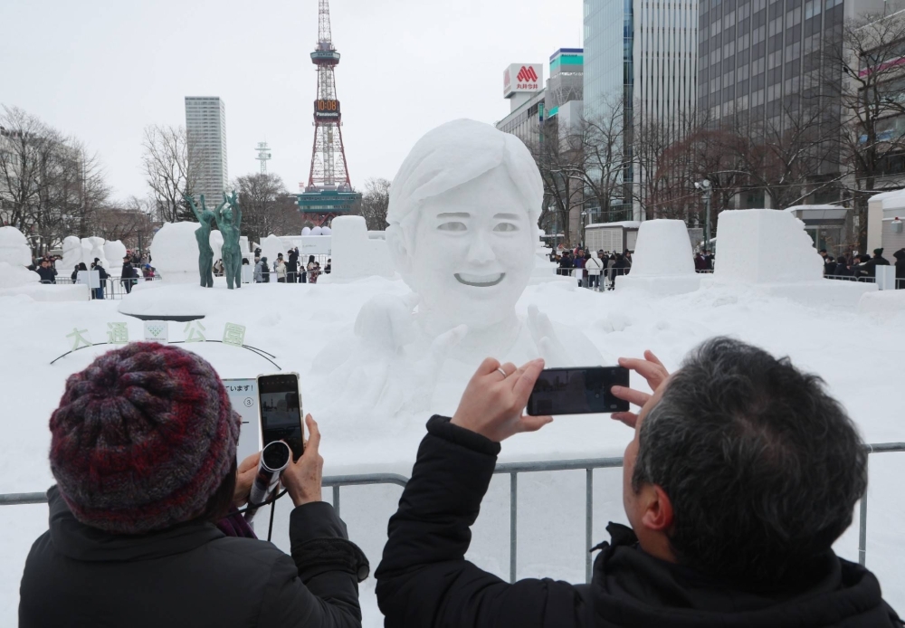 A snow sculpture depicting baseball superstar Shohei Ohtani is among the works on display at the Sapporo Snow Festival.